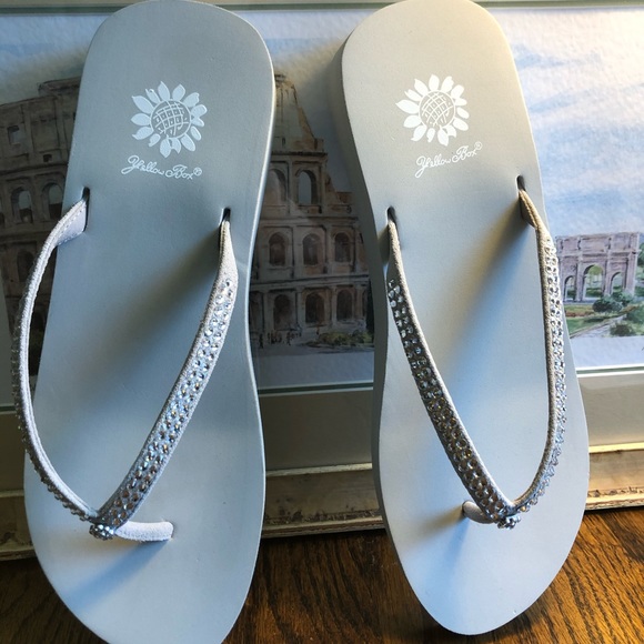 yellow box gray flip flops